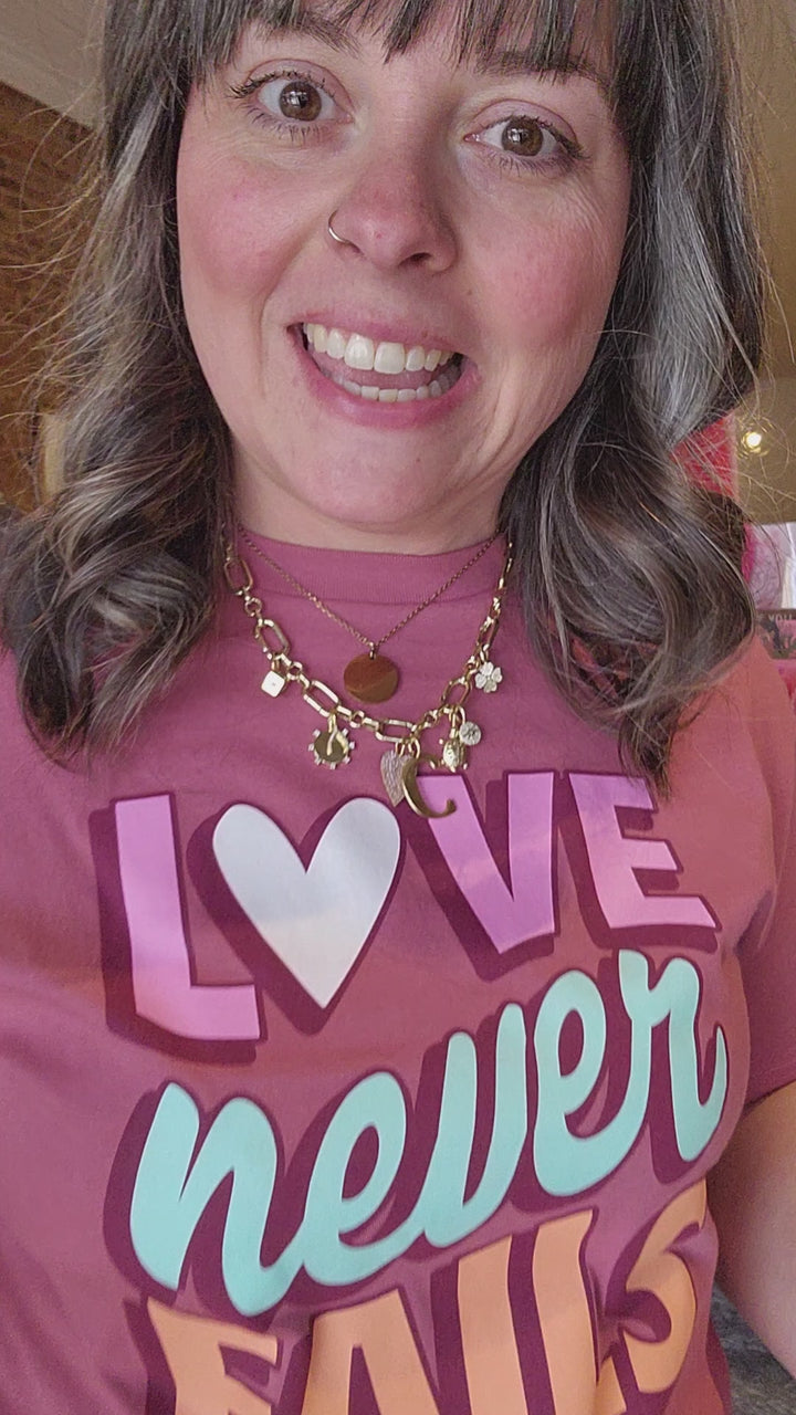Love Never Fails Tee